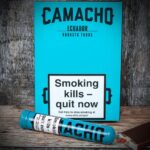 Camacho Robusto Tubos Ecuador aluminum tube cigar on professional display. Order Camacho cigars in Europe